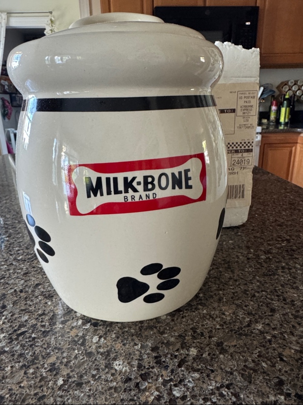 Milk Bone Ceramic Treat Jar in Cream with Black Paw Prints